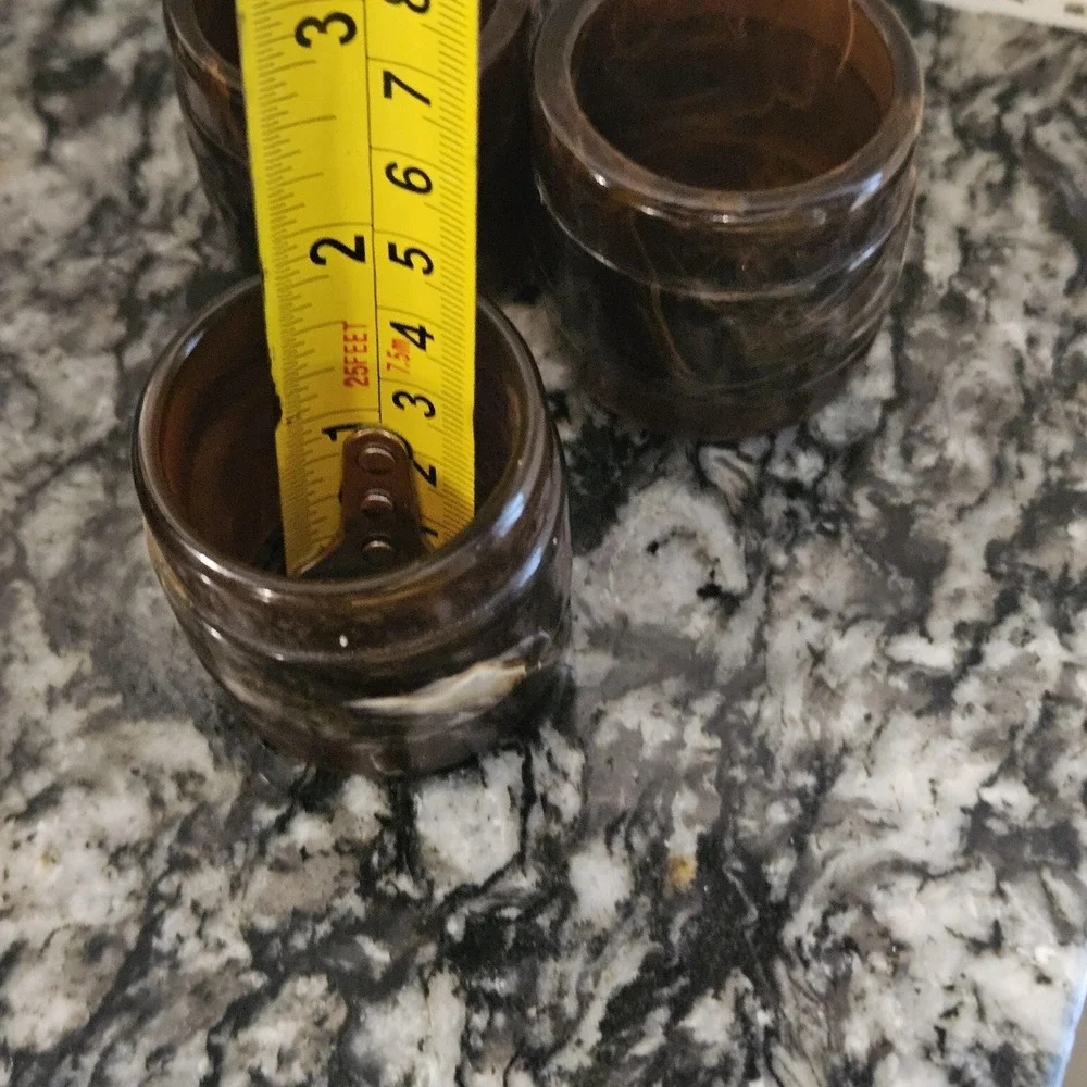 Set of 3 brown swirl like tortoise plastics or bakelite MCM‎ napkin rings